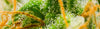 Close-up of a cannabis plant with orange buds and green.
