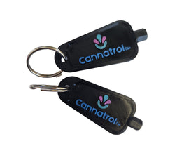 Two black keychains with 'cannatrol' logo on a white background