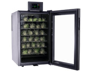 Cool Cure with glass door open, displaying small plants on shelves.